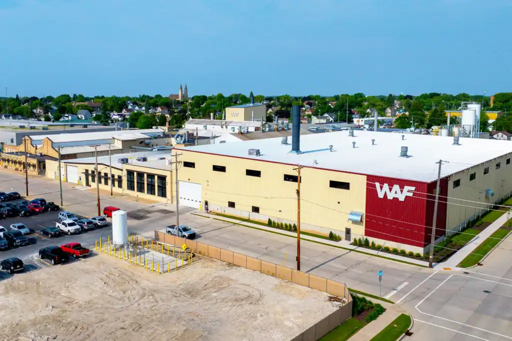 Aerial view of the modern-day Wisconsin Aluminum Foundry Manitowoc facility, focusing on the expanded permanent mold building.