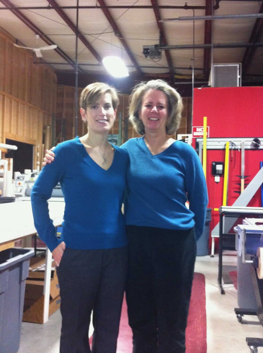 Mother and daughter wearing matching sweater and pants.