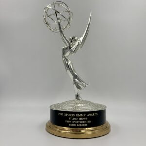 The emmy award trophy, a symbol of excellence in television, is shown on a white background. The emmy award trophy, a symbol of excellence in television, is shown on a white background.