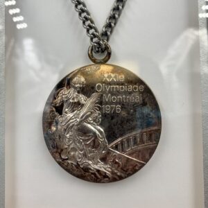 Olympic medal in a display case highlighting the history of women's basketball. Olympic medal in a display case highlighting the history of women's basketball.