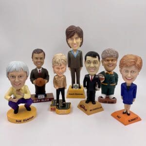 A collection of bobbleheads representing notable women in the history of women's basketball. A collection of bobbleheads representing notable women in the history of women's basketball.