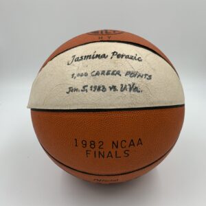 A basketball with a signature on it, showcasing the history of women's basketball. A basketball with a signature on it, showcasing the history of women's basketball.