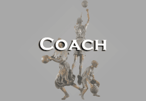 A bronze statue of a coach holding a basketball.