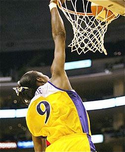 In the history of women's basketball, a skilled player leaps into the air and successfully dunks the ball. In the history of women's basketball, a skilled player leaps into the air and successfully dunks the ball.