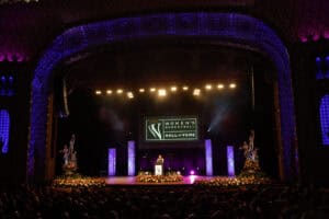 A berenson trophy stage in a large auditorium.