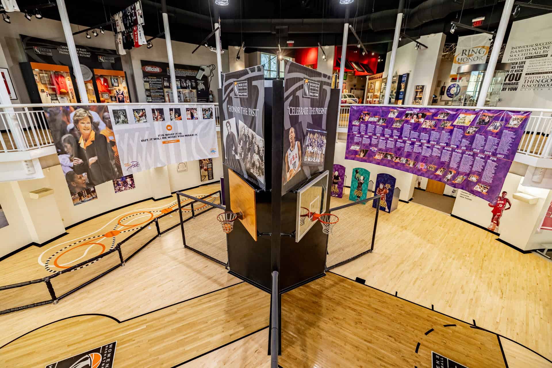 A women's basketball court in a museum with a lot of posters from the Basketball Hall of Fame. A women's basketball court in a museum with a lot of posters from the Basketball Hall of Fame.
