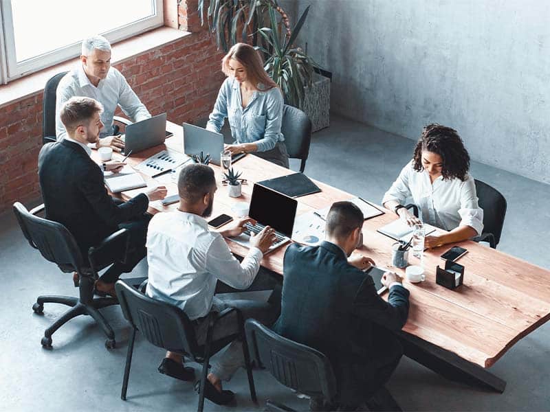 Flexible office team meeting for business solutions at West X Business Solutions.