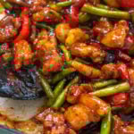 A pan of chicken green bean stir fry
