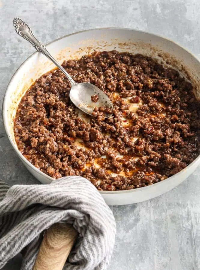 Korean ground beef in a skillet with sweet chili sauce 