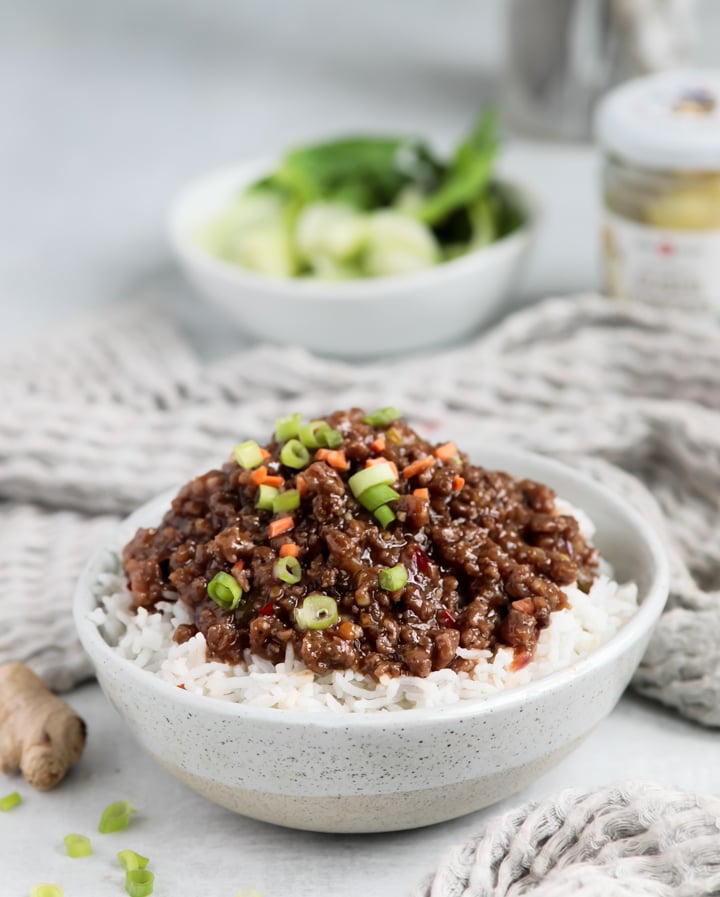 A bowl of Korean beef bowl inspired sweet chili ground beef topped with green onions