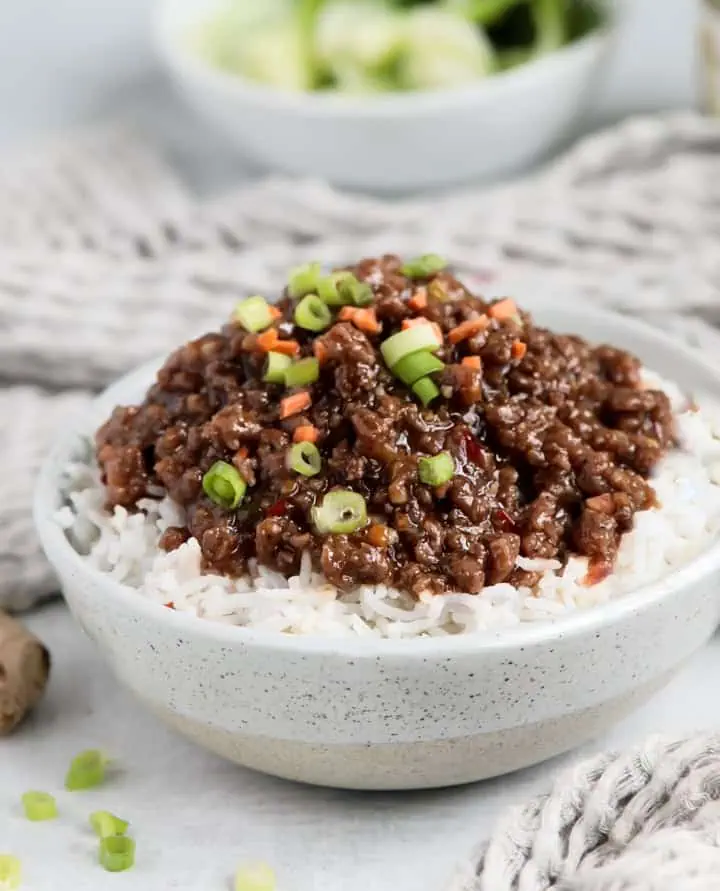 Korean ground beef in a bowl with sweet chili sauce 