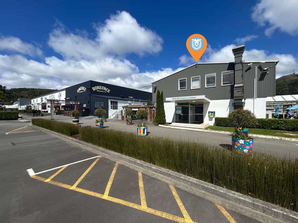 Modern commercial building with White Lion branding and outdoor decor.