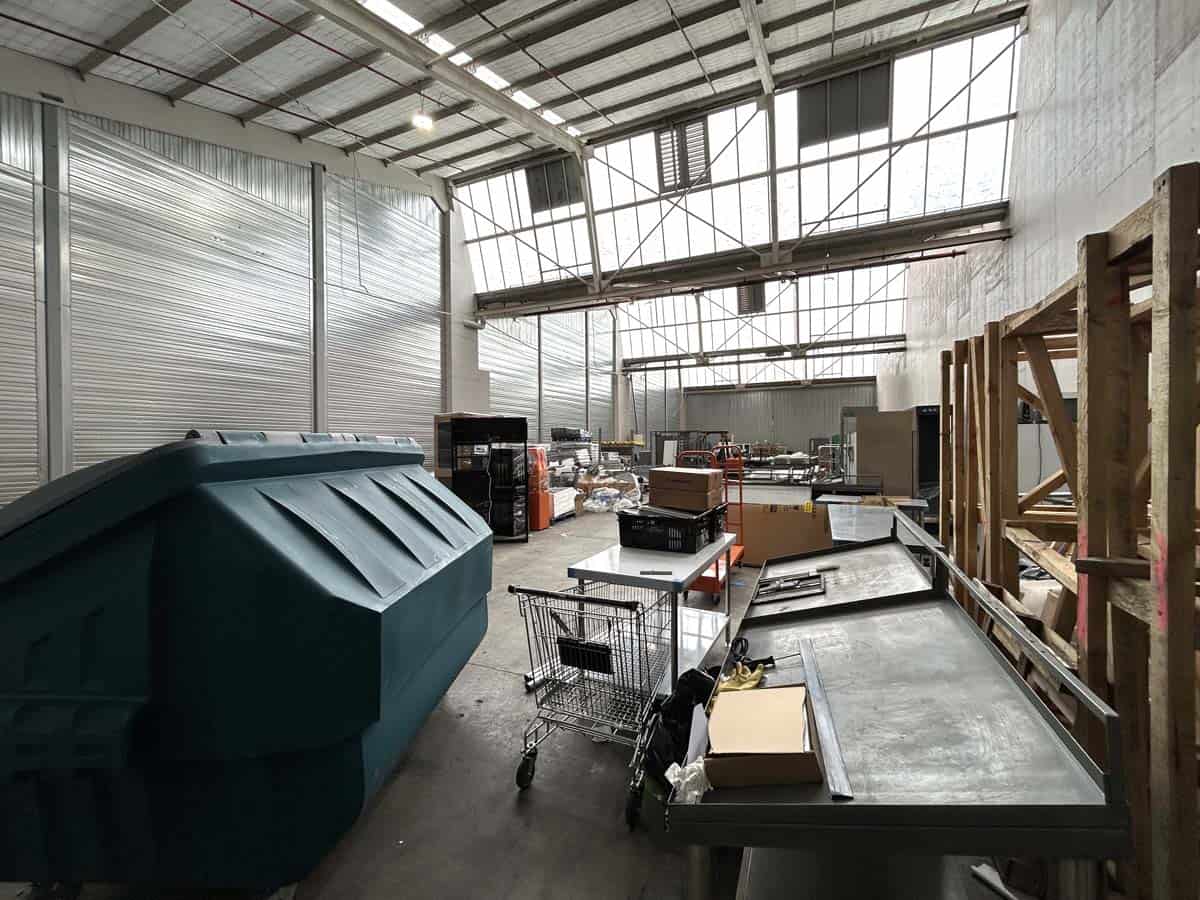 Interior view of White Lion warehouse with storage and shopping carts.