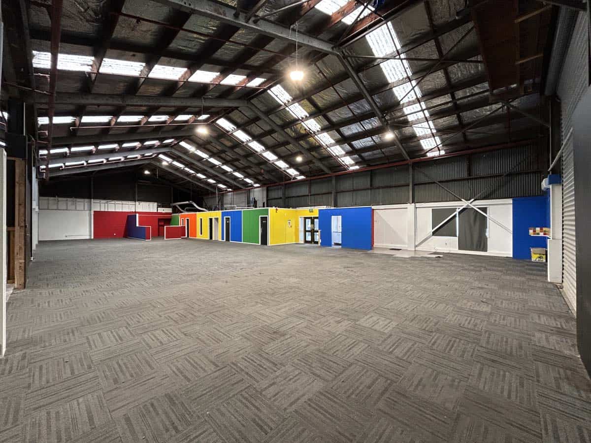 Indoor storage warehouse with vibrant storage containers at White Lion.