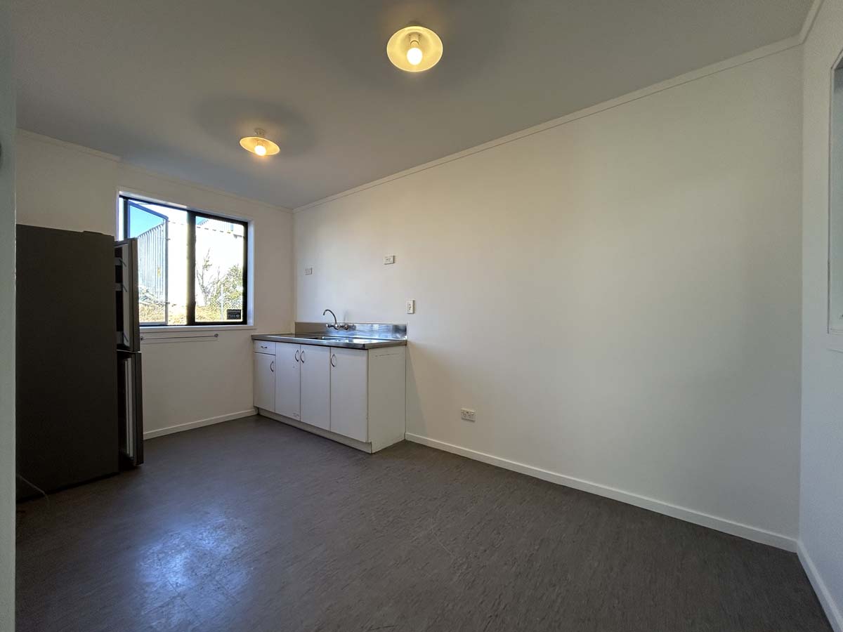 Bright interior of a modern kitchen and living area at 107 Corbett Road.