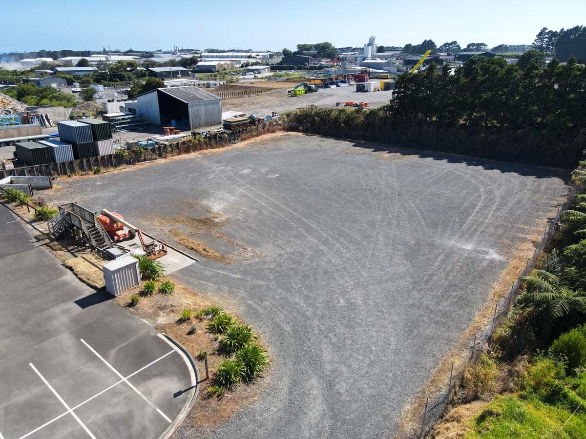 Aerial view of a construction site at 107 Corbett Road, featuring cleared land ready for development.