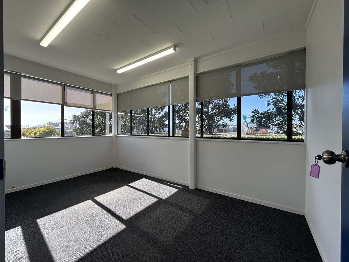 Bright office space with large windows and natural light.