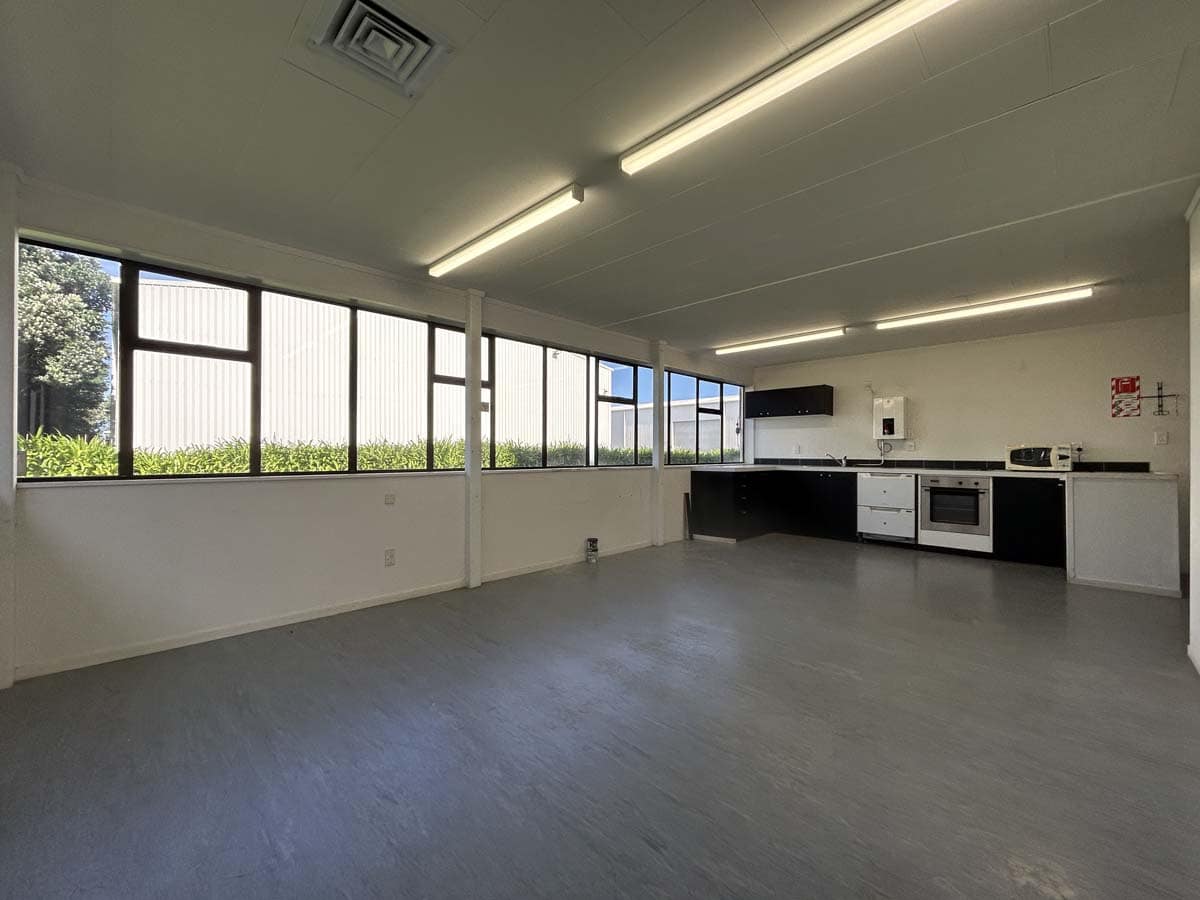 Spacious interior with large windows, ideal for family living.