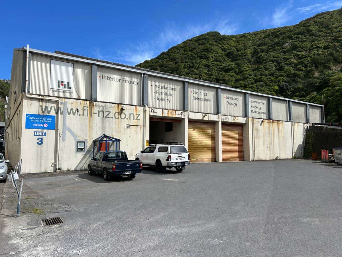 Commercial warehouse at 11-13 Lower Tyers Road with vehicles parked outside.
