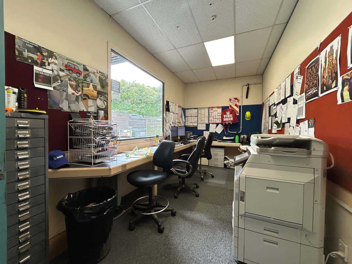 Interior view of White Lion office with desks, chairs, and office equipment.