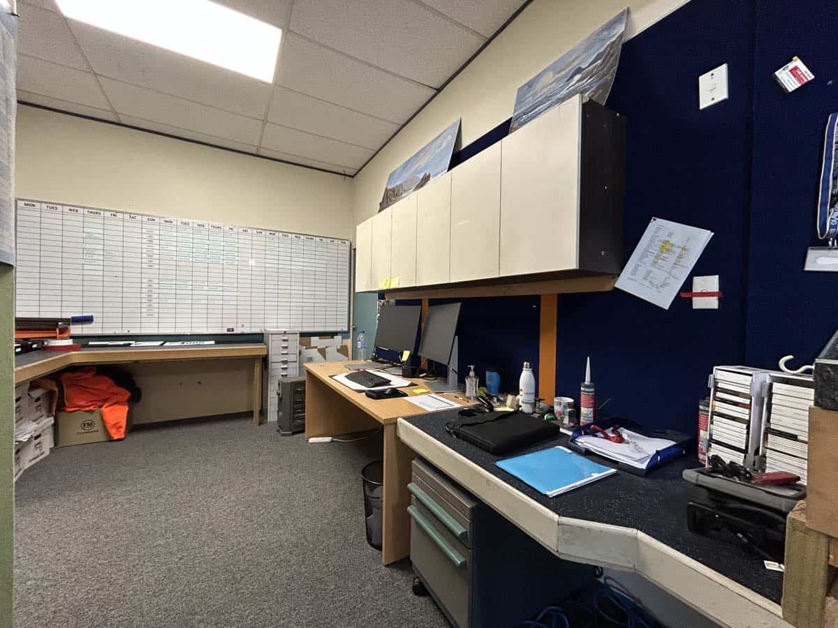 Modern office desk with computers and supplies at White Lion.