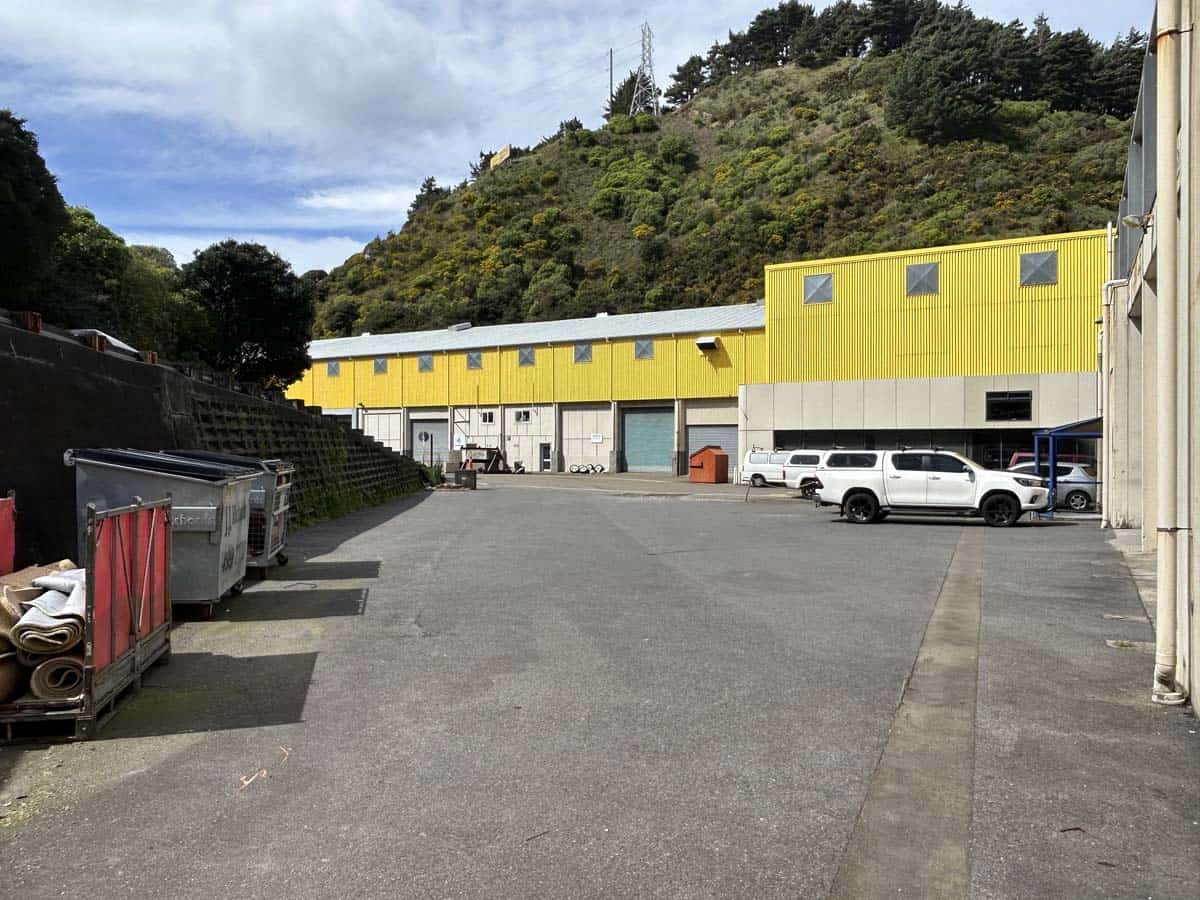 Modern industrial building with yellow accents at 11-13 Lower Tyers Road.