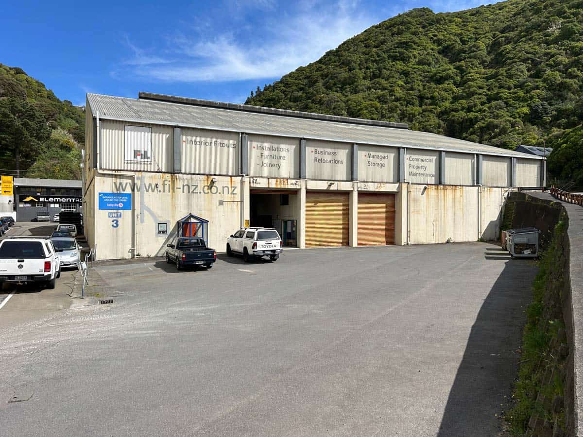 Commercial warehouse at 11-13 Lower Tyers Road with mountain backdrop.