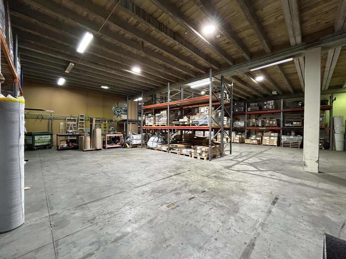Interior view of White Lion warehouse with shelving and storage racks.