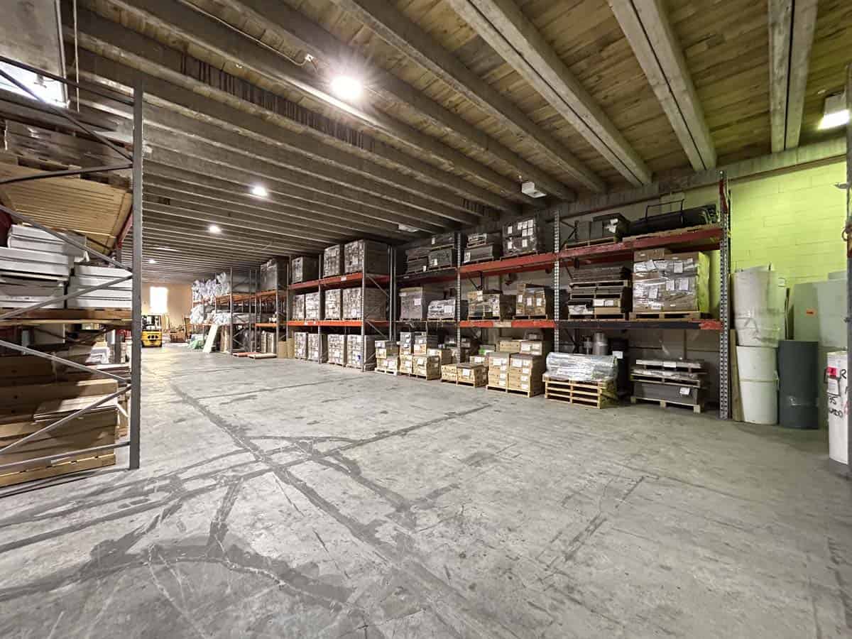 Interior view of White Lion warehouse with shelves of supplies.