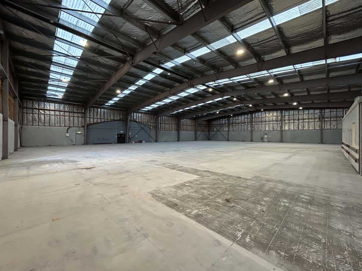 Spacious industrial warehouse with high ceilings and skylights at 14 Tyers Road.
