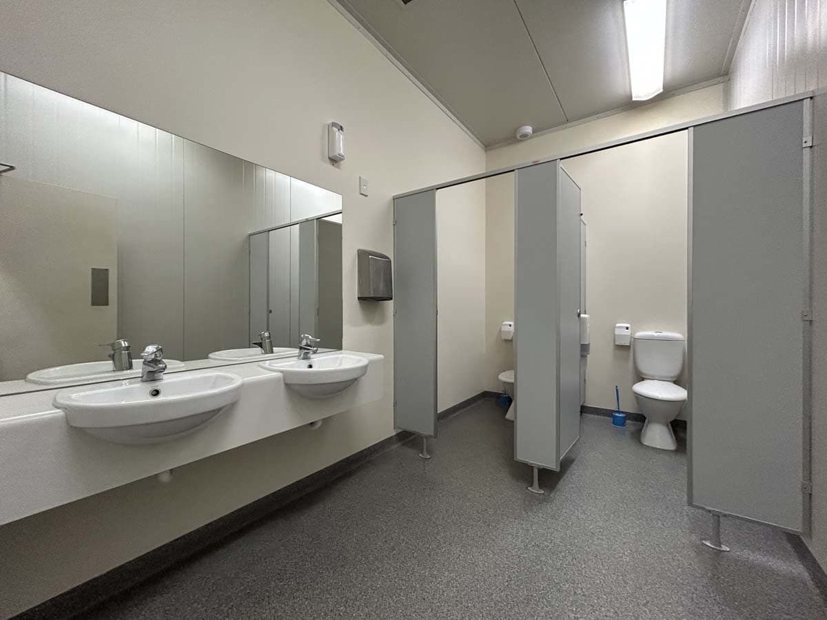 Public restroom with sinks and toilet facilities at 14 Tyers Road, White Lion building.