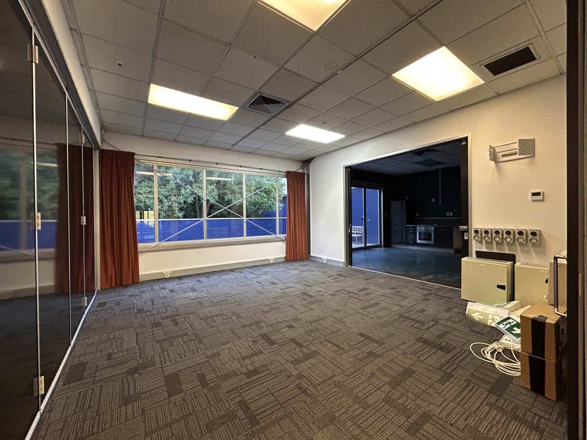 Bright, modern office interior with large windows and ample natural light.