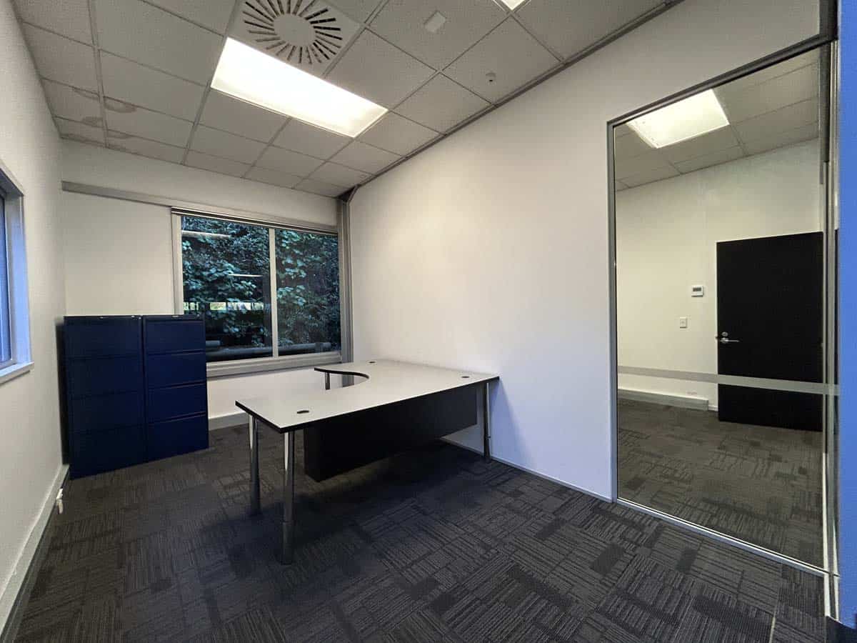 Modern office space with desk and large window at 14 Tyers Road.
