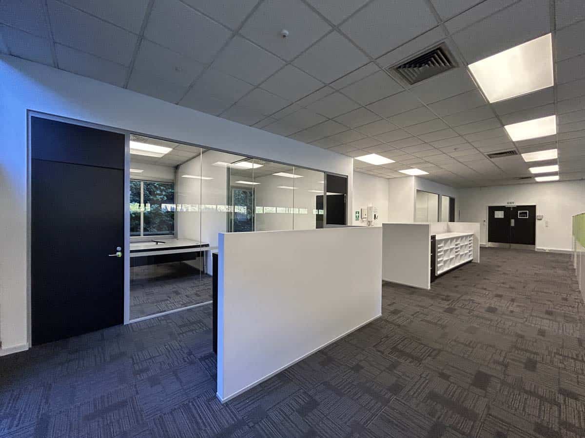 Modern office space with open-plan layout and meeting rooms.