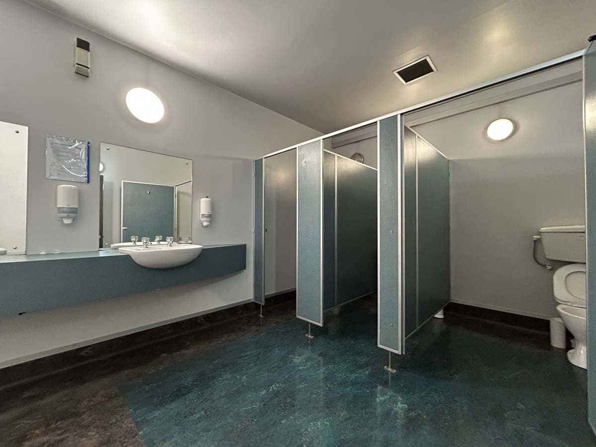 Modern public restroom with cubicles and toilet facilities at 14 Tyers Road.