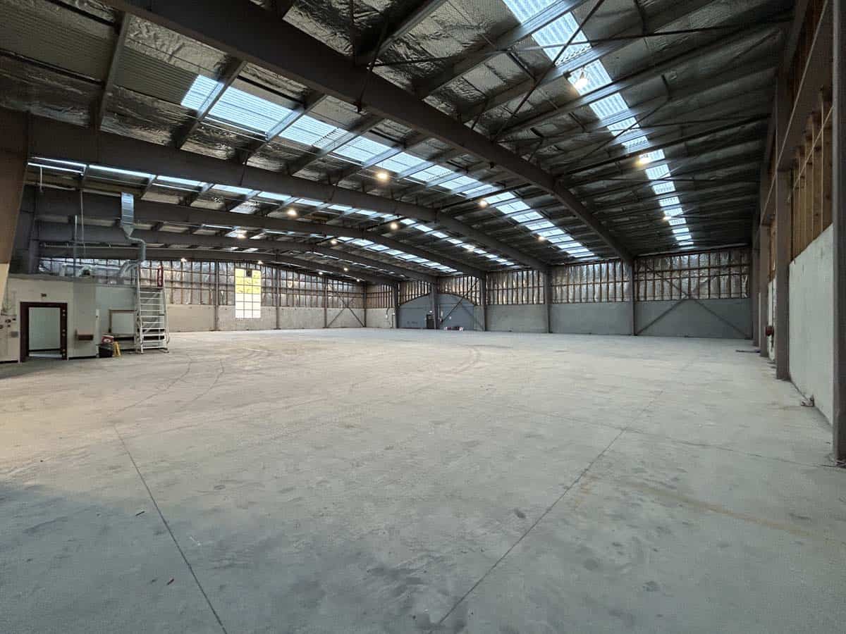 Large industrial warehouse space at 14 Tyers Road with high ceilings and skylights.
