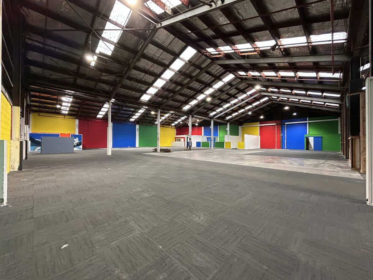 Spacious warehouse with colorful walls and high ceiling at White Lion, 8 Mohuia Crescent 2.