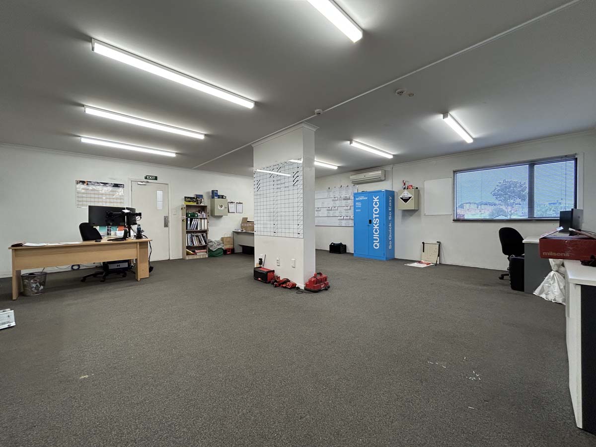 Spacious office space with desks, chairs, and storage at 211 Connett Road.