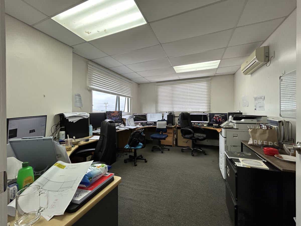 Office workspace with desks and chairs at 211 Connett Road.