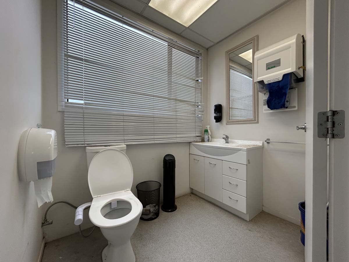 Commercial bathroom renovation at 211 Connett Road, featuring modern fixtures and design.