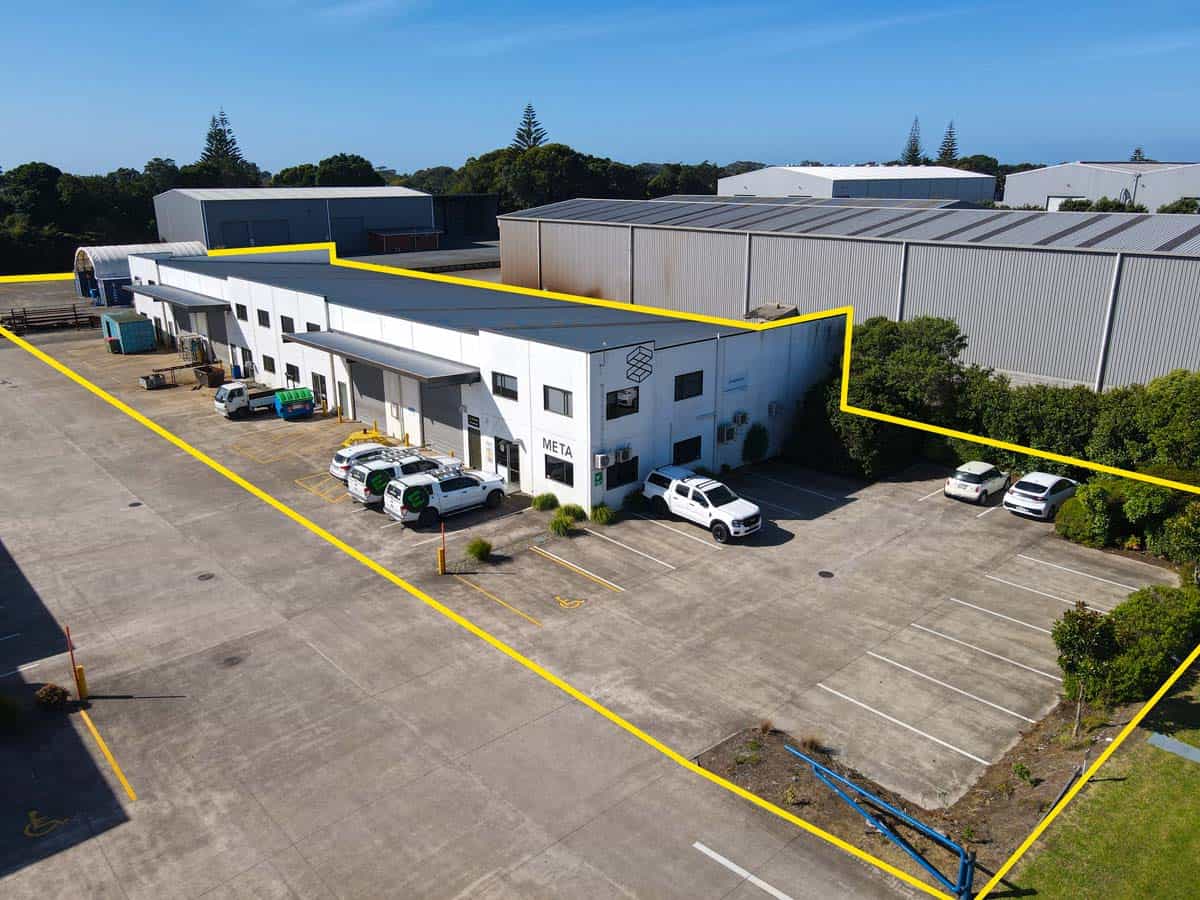 Aerial view of White Lion industrial warehouse at 211 Connett Road with parking area.