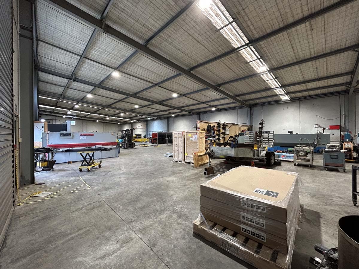 Spacious warehouse interior at White Lion, 211 Connett Road, with equipment and supplies.