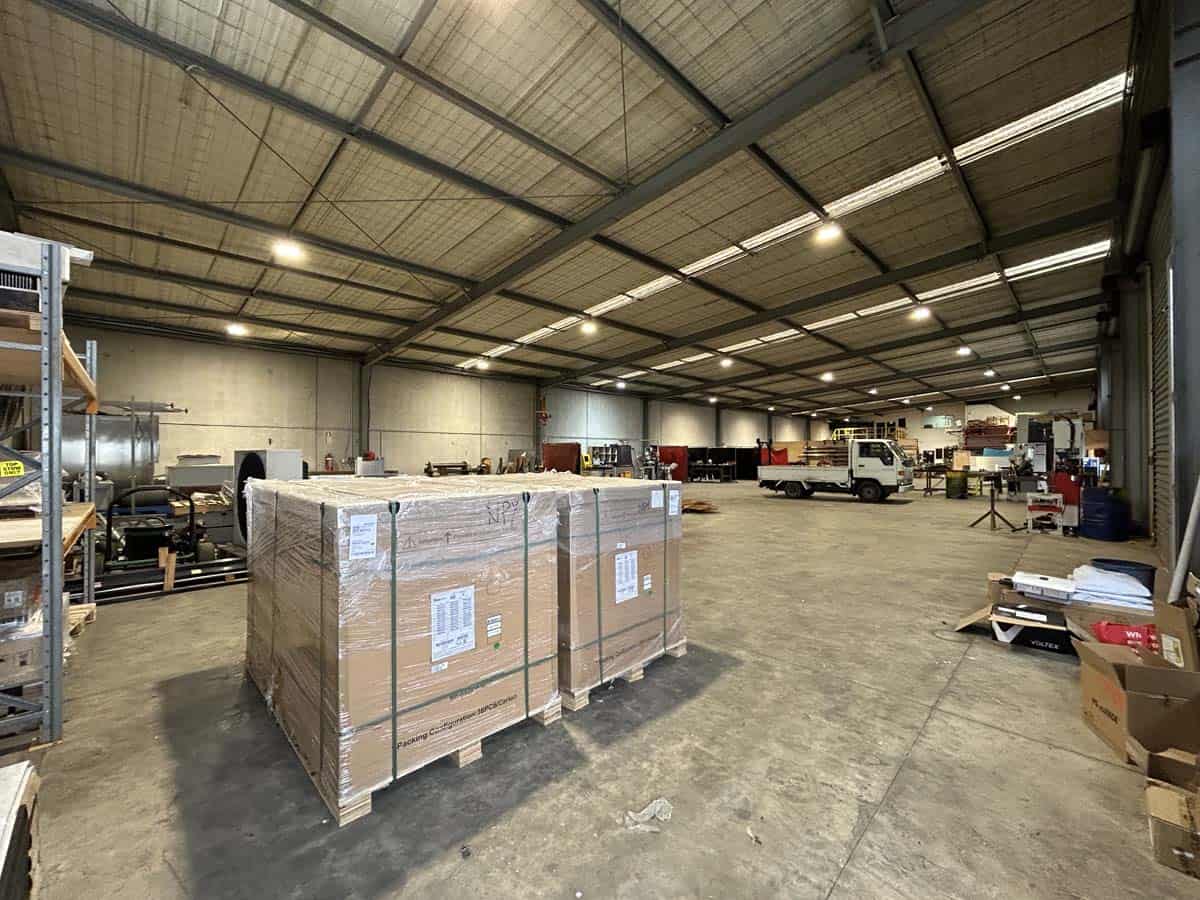 Spacious warehouse interior with pallets and equipment at 211 Connett Road.