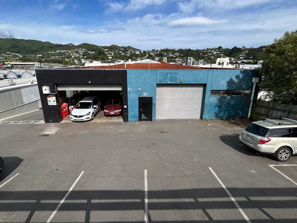 Modern Blue and Black Commercial Building with Parking at 31 Johnsonville Road.