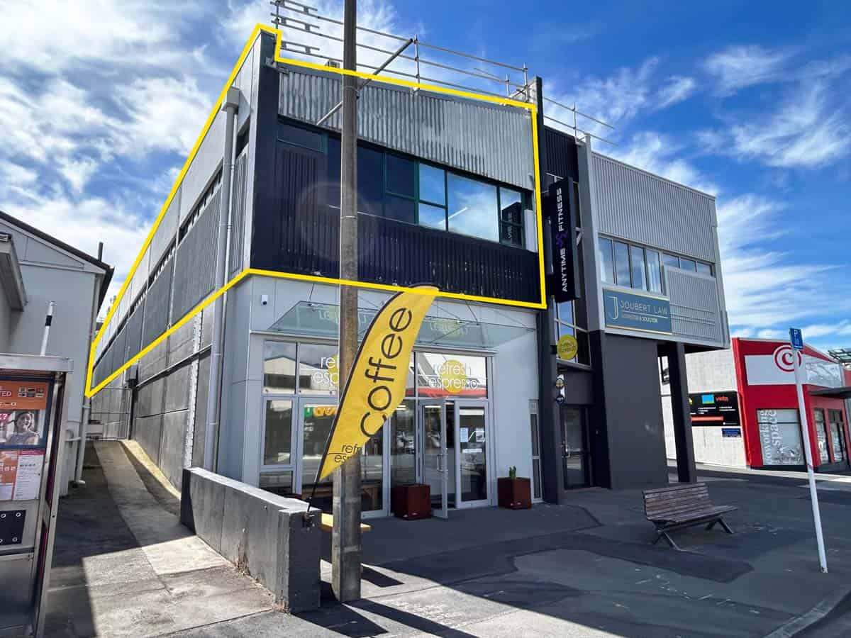 Modern commercial building at 31 Johnsonville Road with signage.