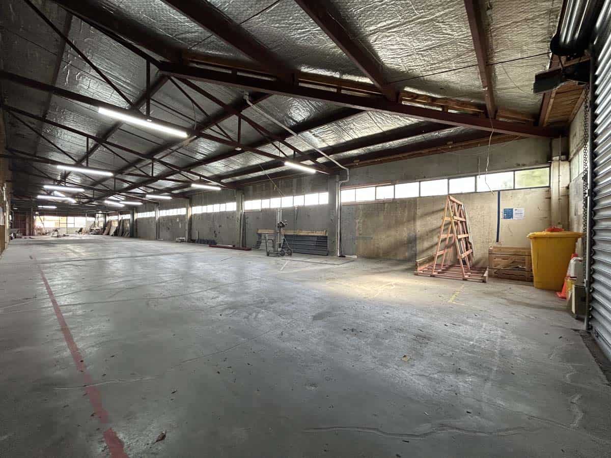 Interior view of a spacious warehouse at 31 Johnsonville Road, featuring high ceilings and industria.