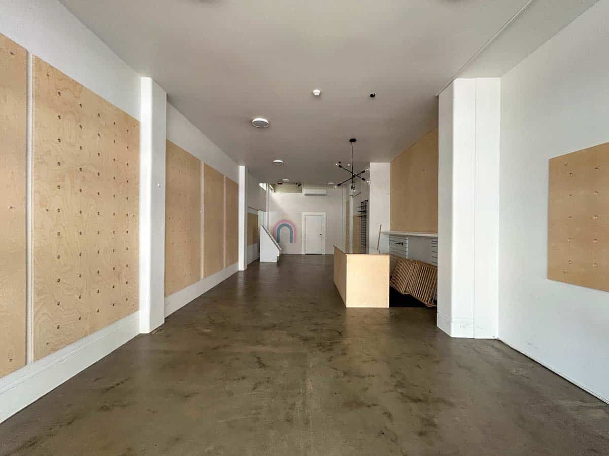 Interior view of White Lion venue at 38 Devon Street West, showcasing a modern, minimalist design wi.