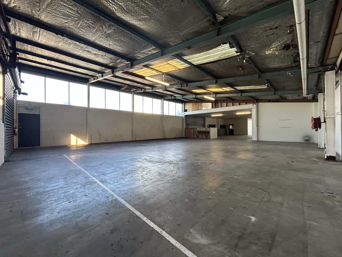 Spacious industrial warehouse at 45 Waione Street with high ceilings and natural light.