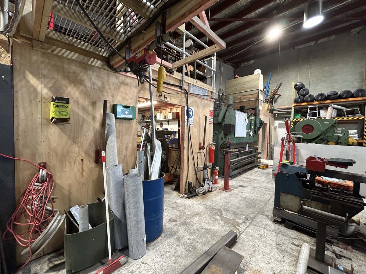 Workshop interior with metalworking and woodworking tools at White Lion, 47A Victoria Street.