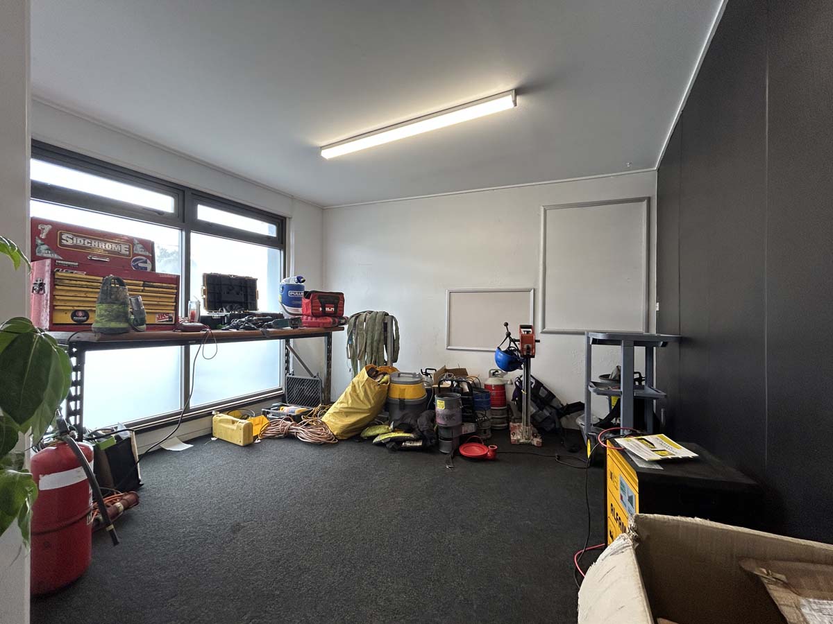 Interior of White Lion at 47A Victoria Street, showcasing equipment and workspace.